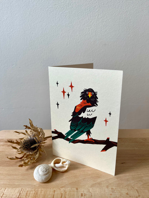Bateleur Eagle greetings card -- greeting card with a bird illustration on a wooden surface with decorative elements.