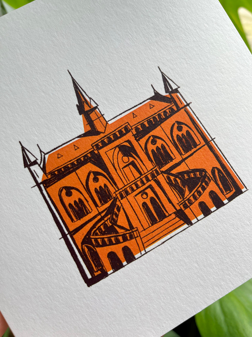 McManus Gallery greeting card -- close-up of an Illustration of a 'castle' on a white card with green background.