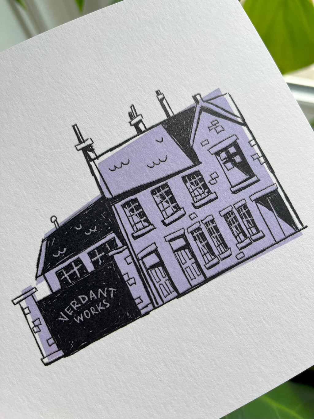 Verdant Works greetins card -- close-up of an Illustration of a house on a white card with 'Verdant Works' branding.