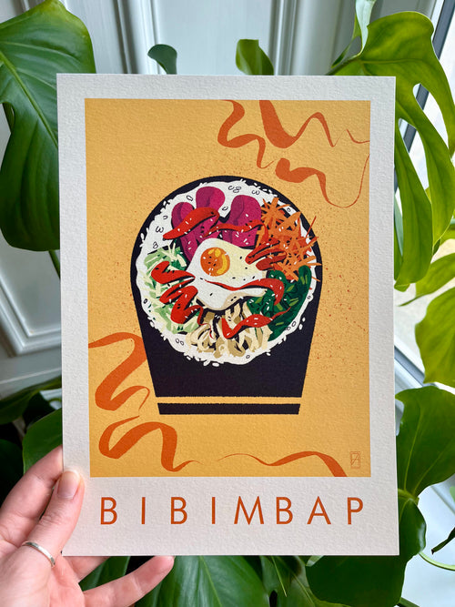 Bibimbap print -- hand-held A4 print of bibimbap.