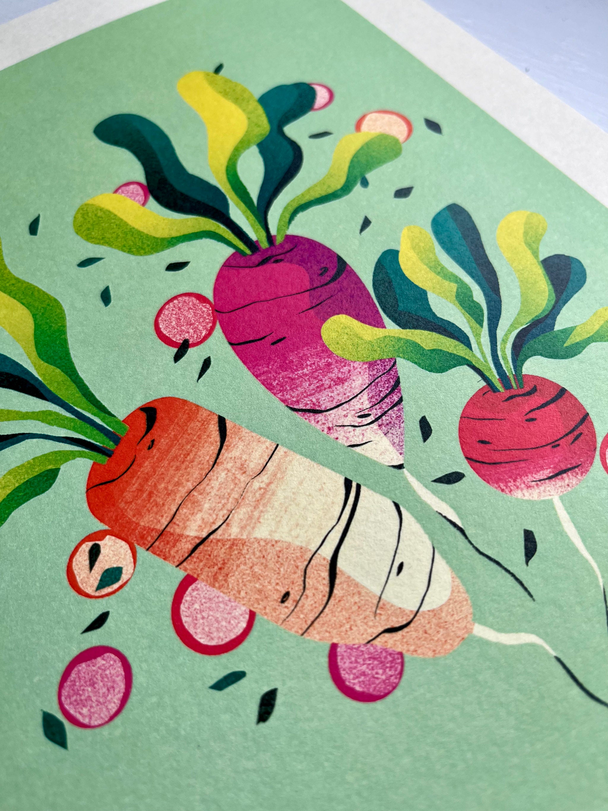 Radishes print -- close-up of an Illustration of carrots and radishes on a green background.