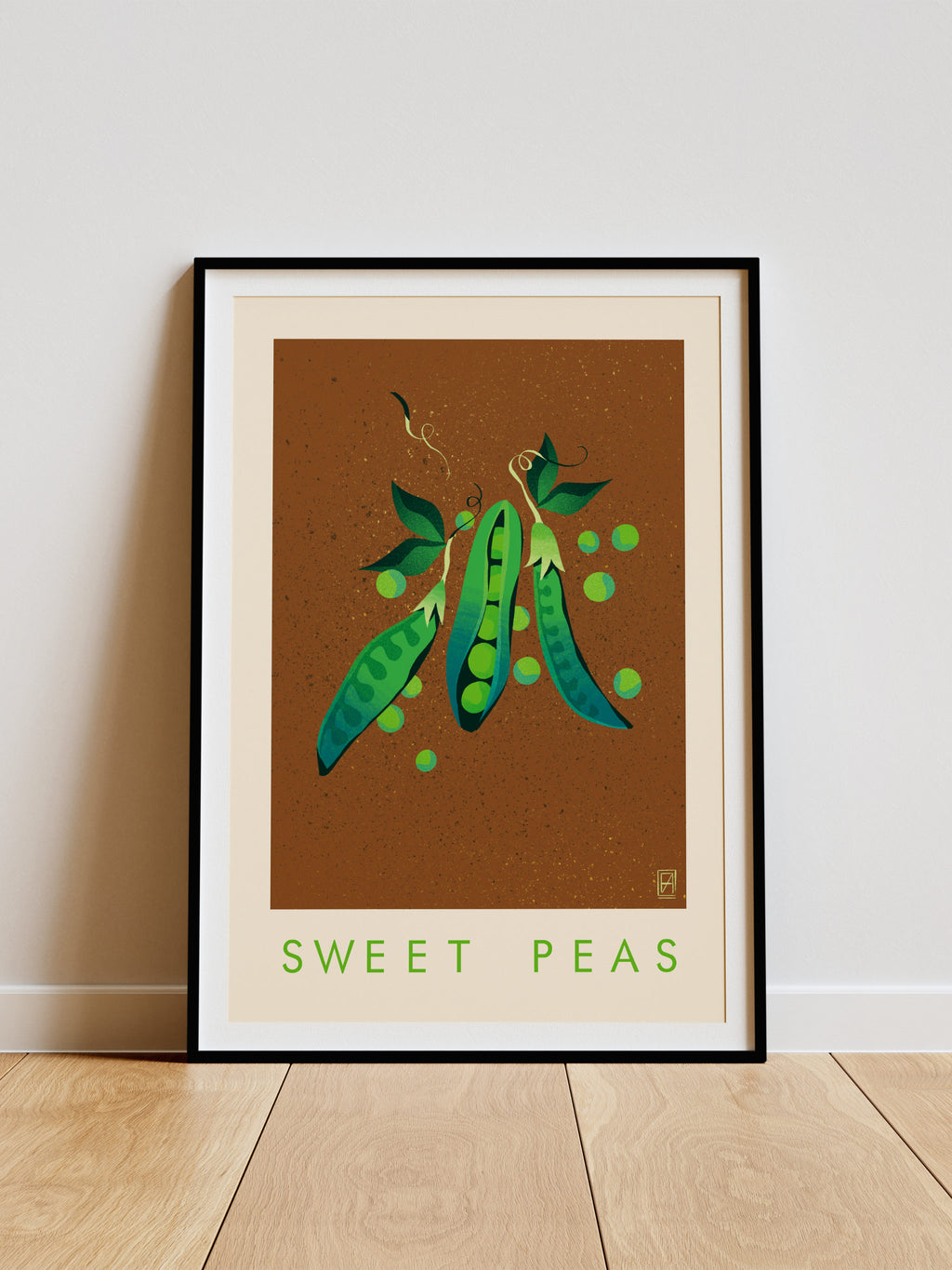Sweet Peas print -- framed artwork of sweet peas on a brown background with 'Sweet Peas' text, leaning against a white wall.